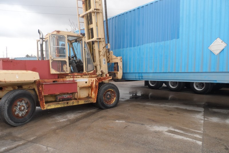 Forklift handling a container at the Superior yard